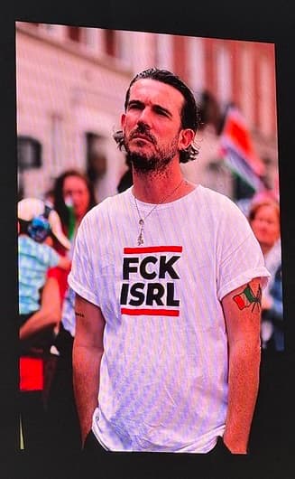 Trevor Dietz, wearing a t-shirt that reads FCK ISRL