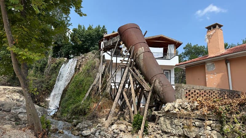 Broken aqueduct with a metal chute where it is broken is a waterfall