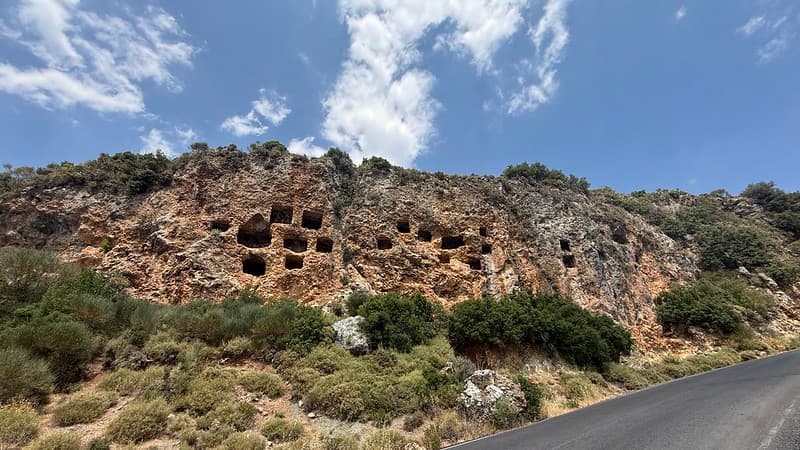 Small square shaped rooms carved into the cliff face